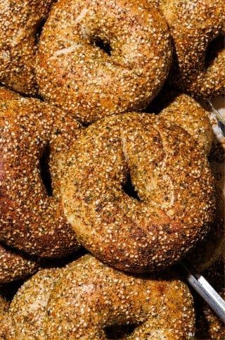 A pile of seeded bagels