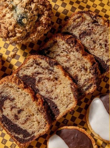 Sliced babka, muffins, and black-and-white cookies
